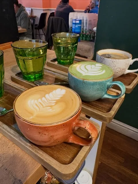 Colourful cups of coffee at Outset Coffee