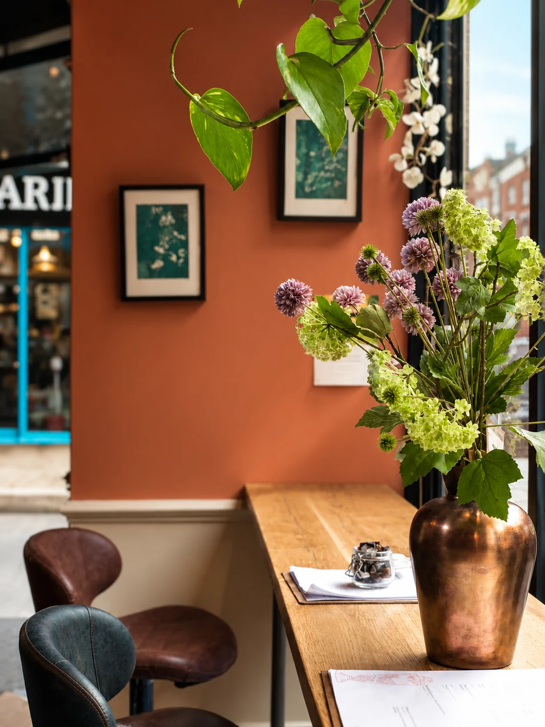 Flowers and a table inside Outset Coffee